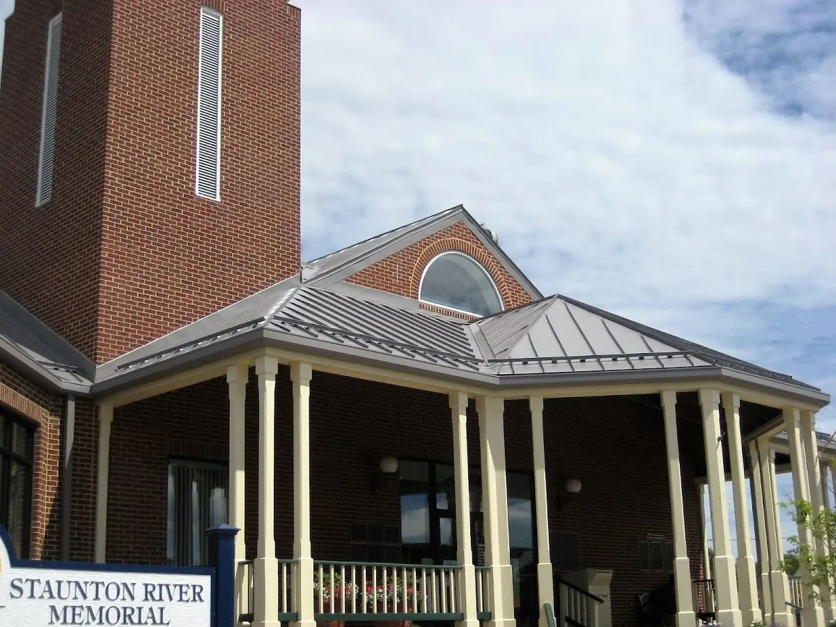 Skilled roofing craftsmen working on a residential roof in Poplar Springs